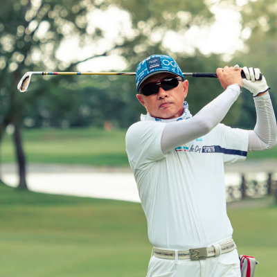 Man after swing wearing golf sunglasses - Ultimate guide to Golf sunglasses